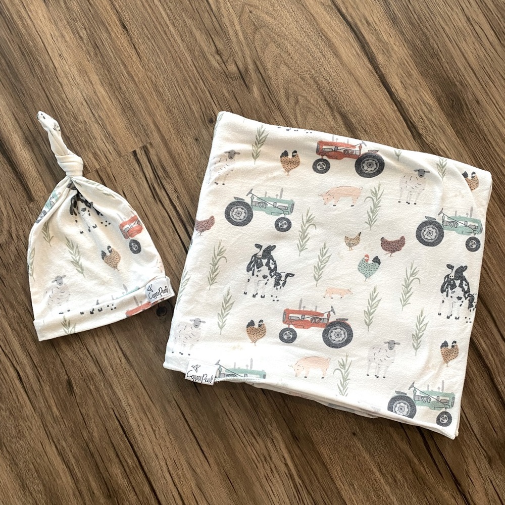 Copper Pearl “Jo” swaddle blanket and matching knotted hat.